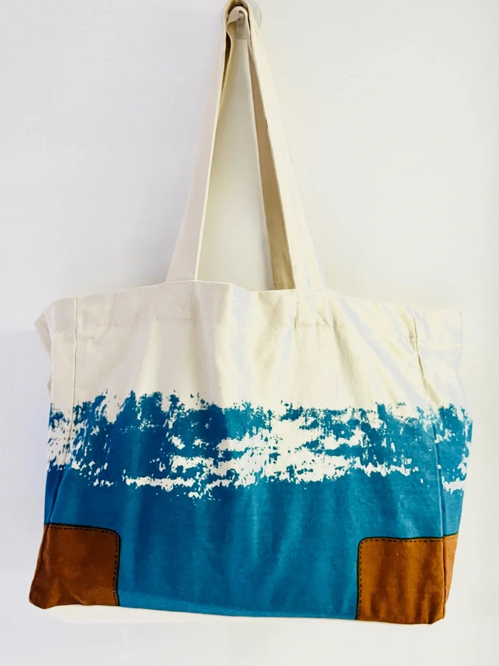 Tory Burch features cream
